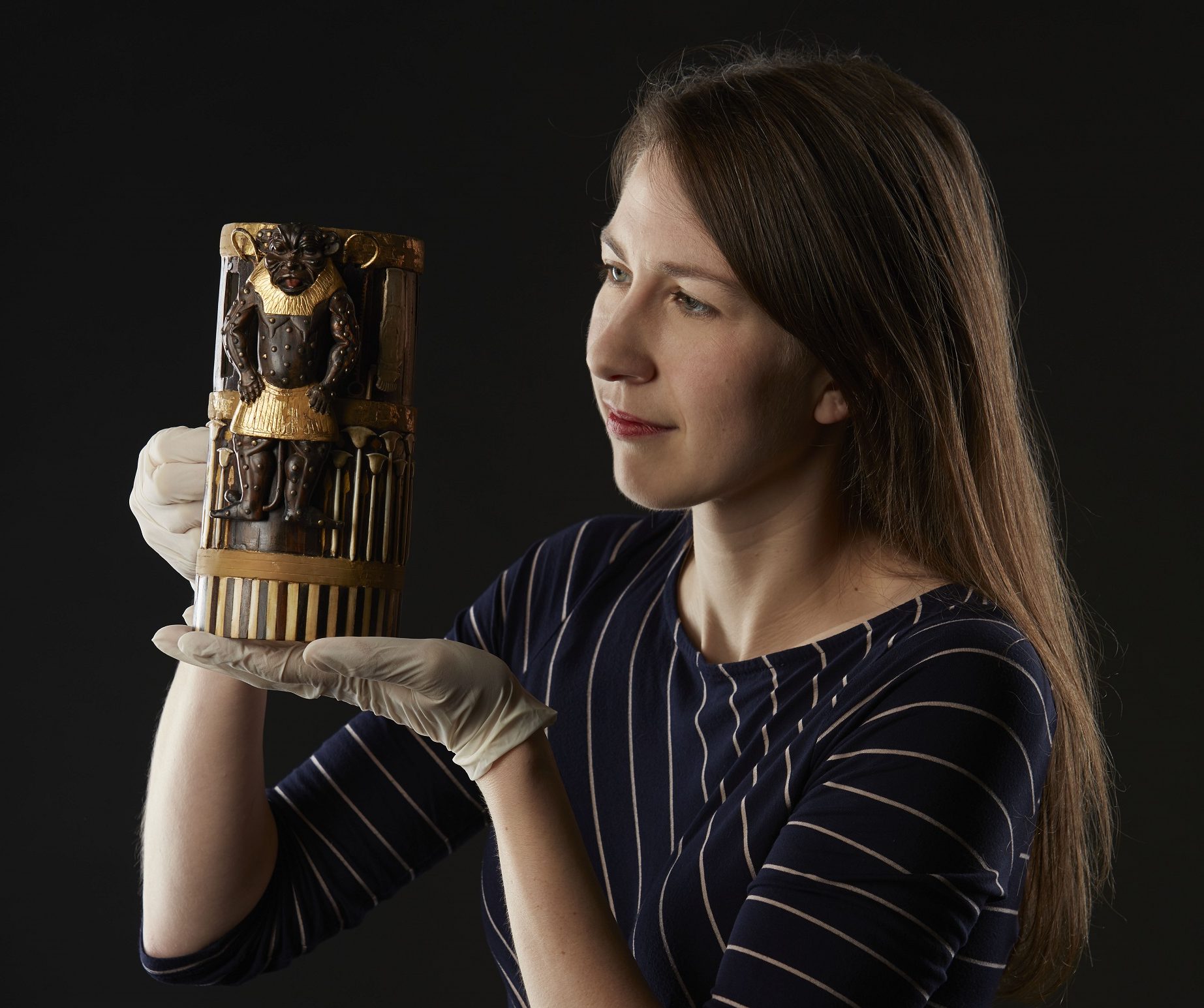 Dr. Margaret Maitland inspects a decorative box inscribed for King Amenhotep II