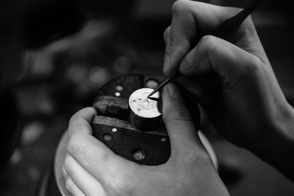 Society silver pin badge in the making