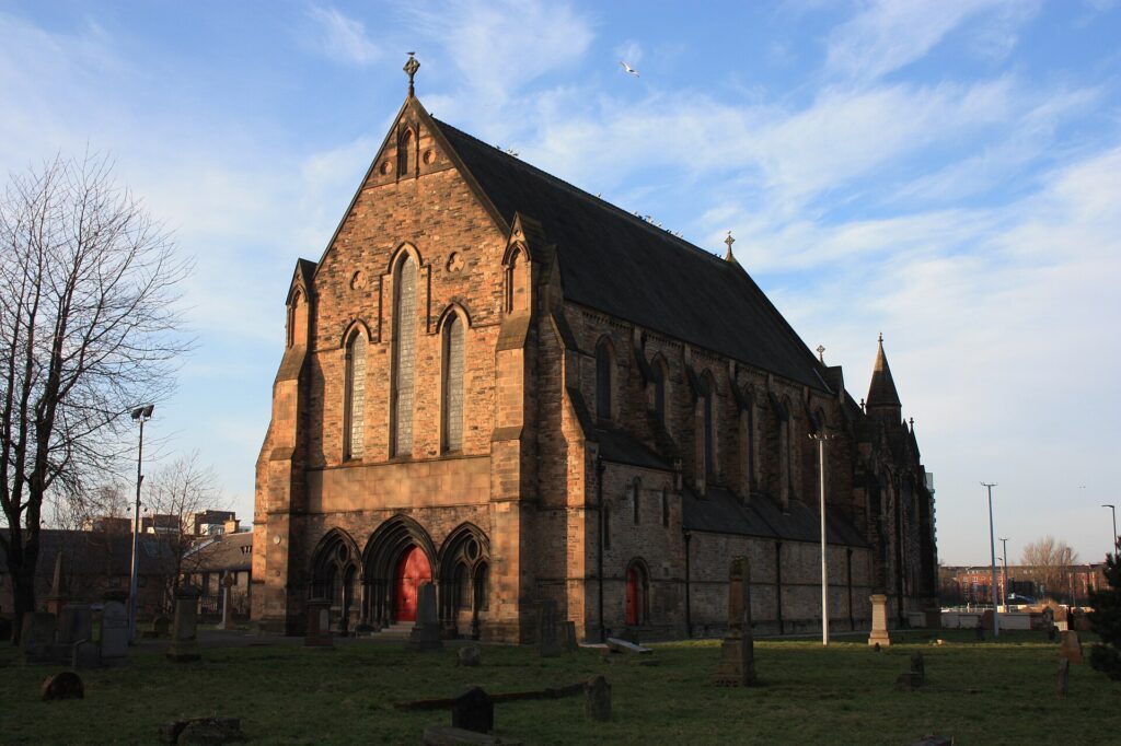 Photo of an old church and graveyard in the evening sun