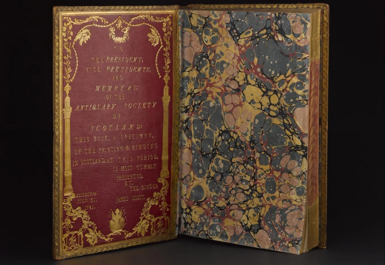 Photo of the front board of a decorated book