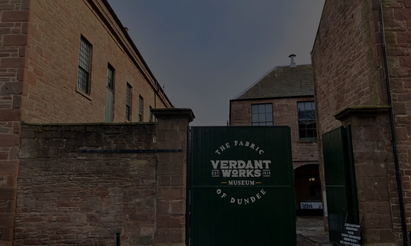 Photo of an old industrial factory gates with ``Verdant Works`` written on them