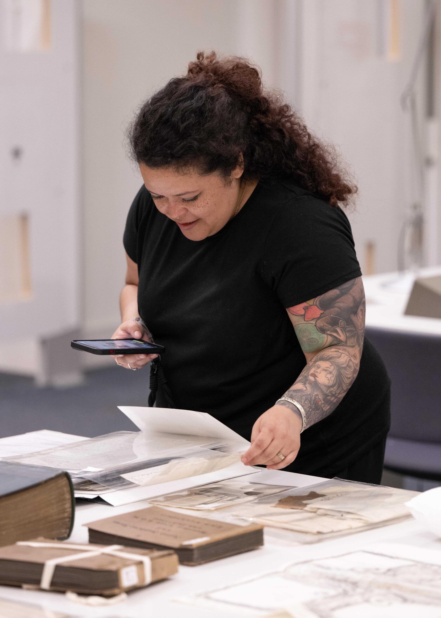 Person getting a book off a shelf